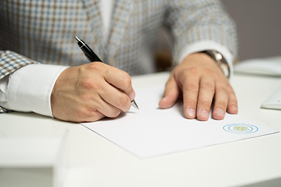 person signing a contract